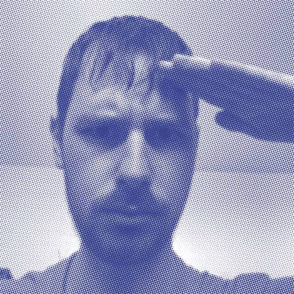 A serious-looking man saluting.