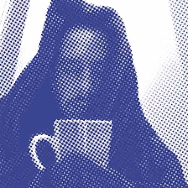 A man wrapped up in a cozy blanket, holding a cup of tea and nearly falling asleep.